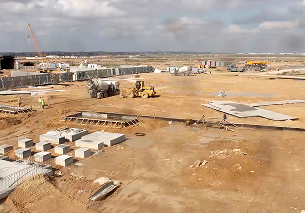 Construction workers prepping power plant site