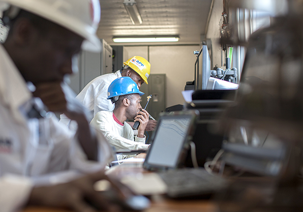 APR Energy employees working in on-site control room