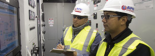 APR Energy employees routinely monitoring control panel and displays